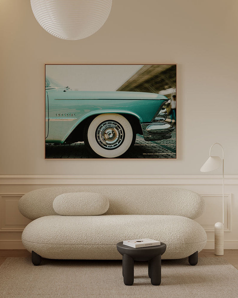 Horizontal canvas wall art featuring a vintage blue classic American car with chrome details and whitewall tires. Printed on high quality canvas in japandi living room