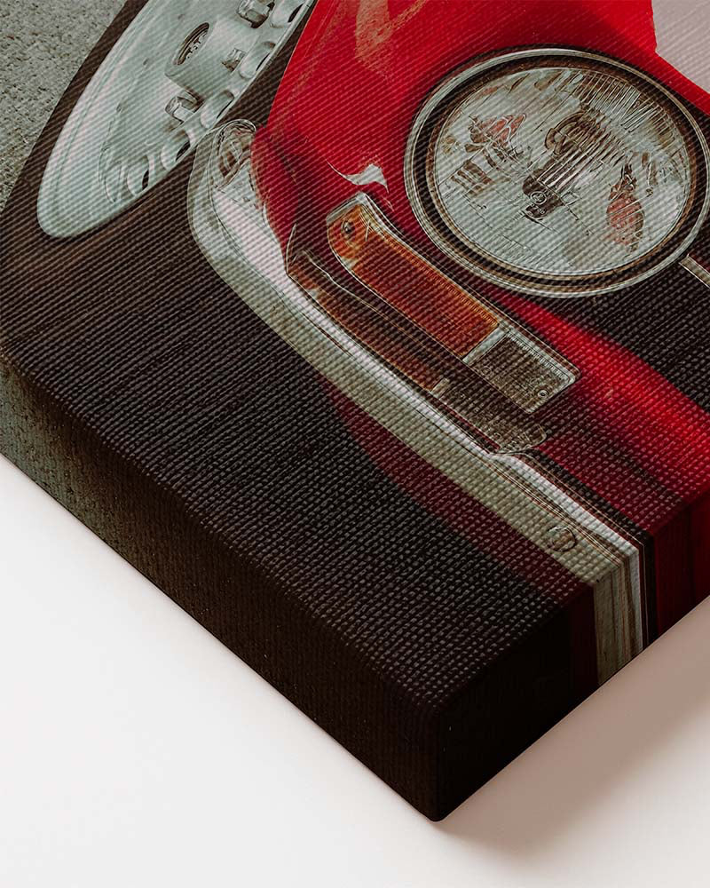 Vertical canvas wall art featuring a close-up of a red vintage classic car with round headlight, chrome bumper, and retro details. Printed on high quality canvas CLose up